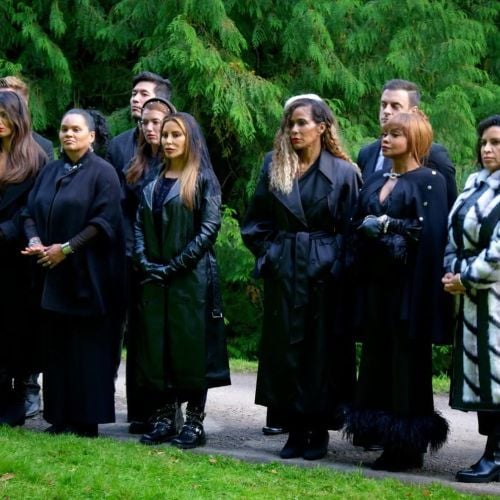 Shereé Whitfield (front row, third from right) in the television series The Traitors