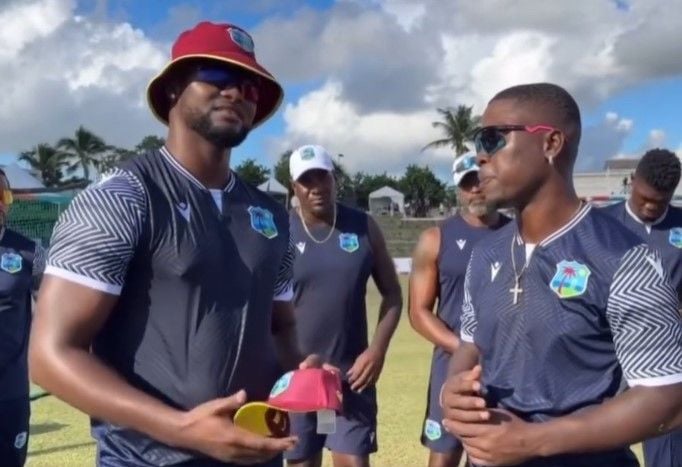 Sherfane Rutherford (right) being given his ODI cap by Romario Shepherd on his ODI debut