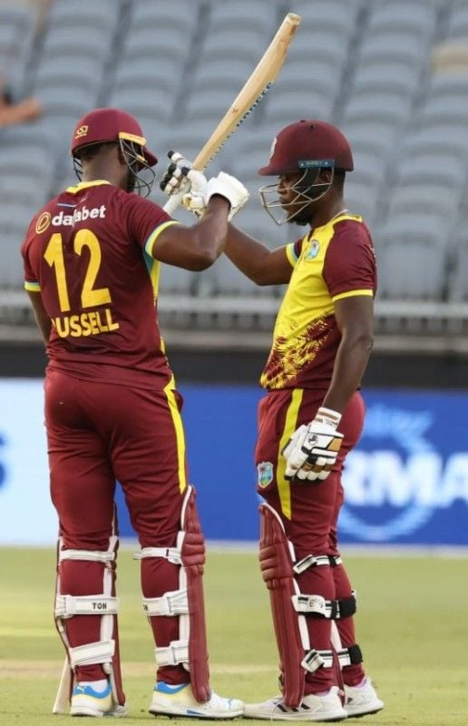 Sherfane Rutherford (right) celebrating his first T20I half century