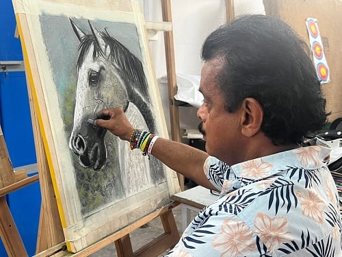 Shihan Hussaini making a painting
