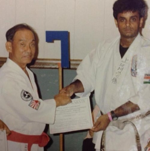 Shihan Hussaini receiving a certificate in karate