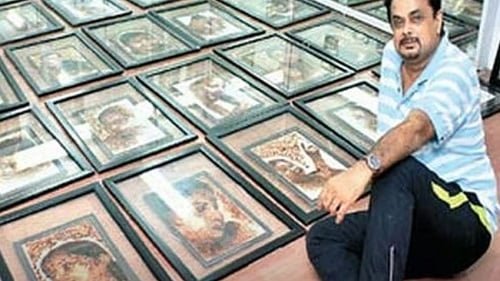 Shihan Hussaini with the portraits of J. Jayalalithaa