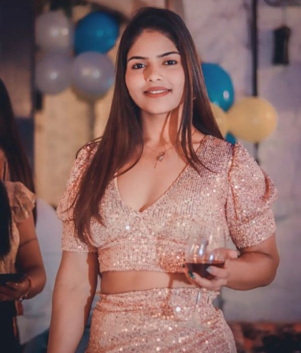 Shivani Gupta holding a glass of wine