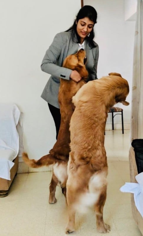 Shivani Pruthvi playing with her pet dogs