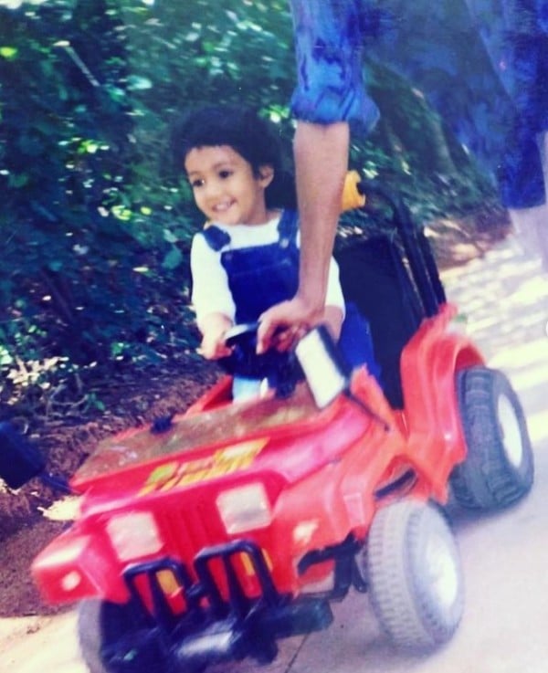 Shivani Pruthvi riding a toy car during her childhood