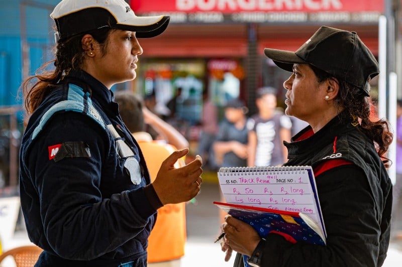 Shivani Pruthvi with her mother, Deepti Pruthvi (right), discussing the track of a race