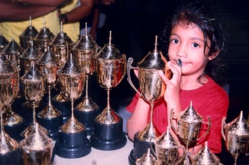 Shivani Pruthvi with the trophies won by her father in racing
