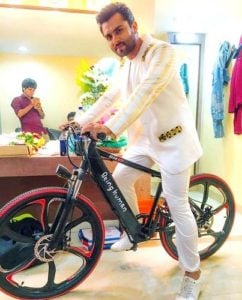 Shoaib Ibrahim poses with his Being Human cycle