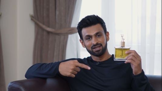 Shoaib Malik posing with his signature perfume All Rounder