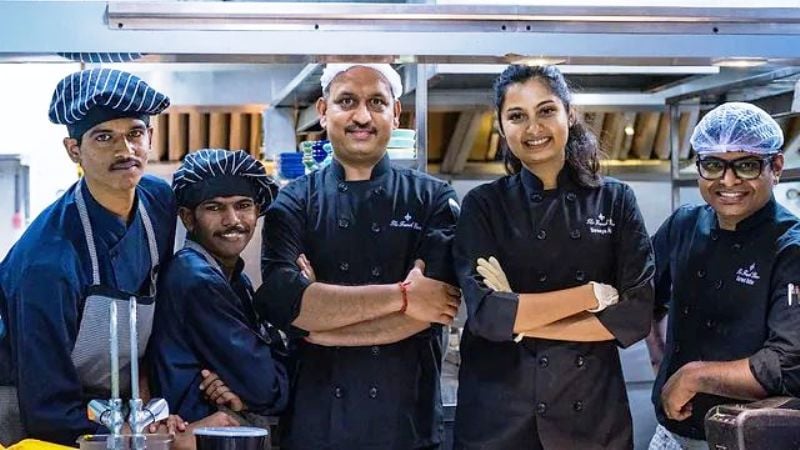 Shreeya Adka (second from right) with her staff at her restaurant