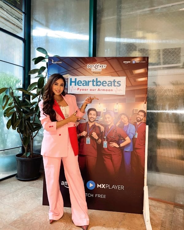 Shreya Kalra posing with her web series poster Heartbeats Pyaar aur Armaan
