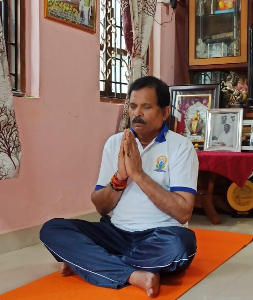 Shripad Naik during a yoga session at his home