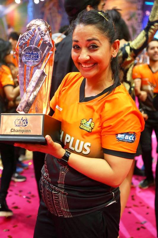 Shruti Ulfat posing for a photo with the BCL trophy