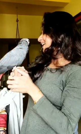 Shyji ADS with her pet parrot