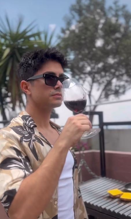 Sian Chiong consuming red wine