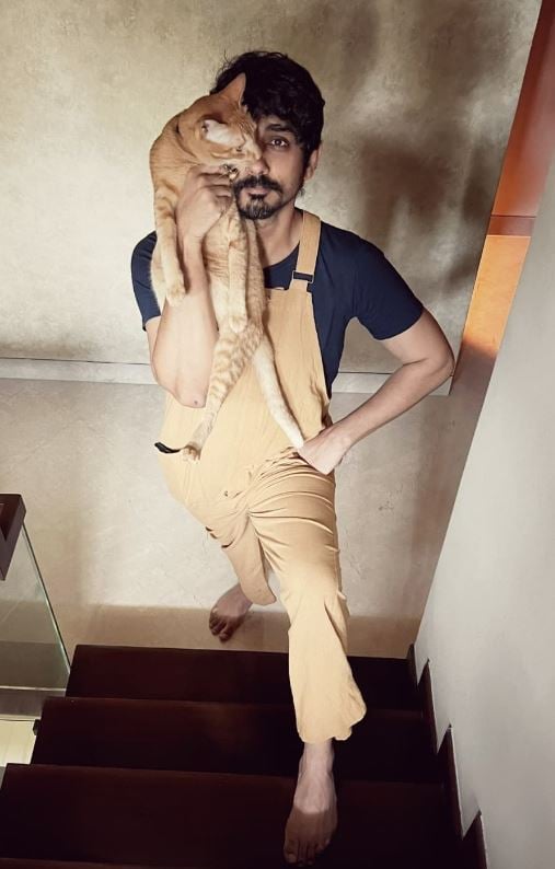 Siddharth with his cat, Tatcho