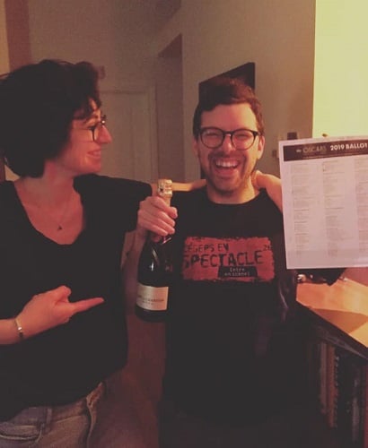 Simon Boulerice with a bottle of champagne