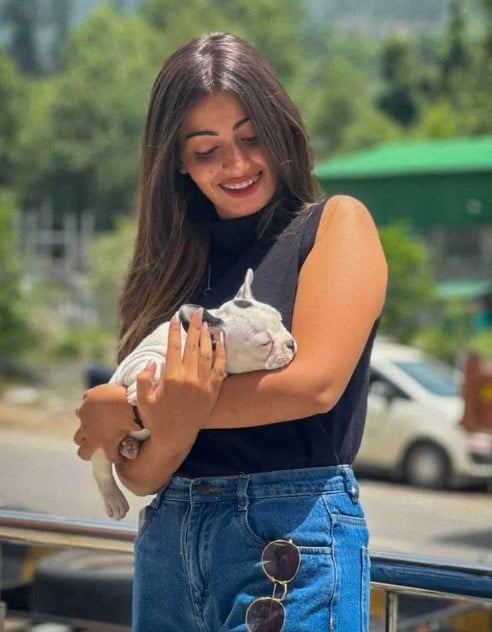 Simran Behl posing with her pet