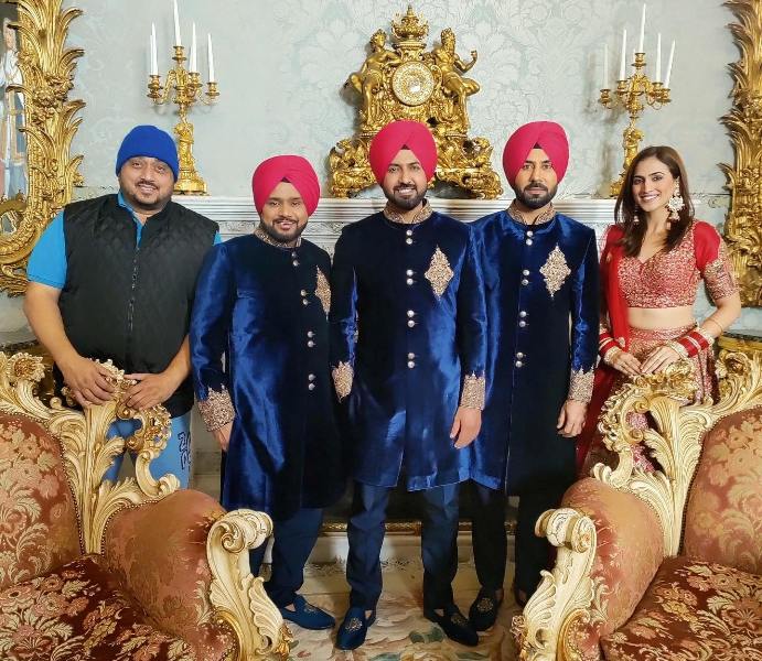 Smeep Kang, Karamjit Anmol, Gippy Grewal, Binnu Dhillon, and Hashneen Chauhan during the shoot of a film (left to right)
