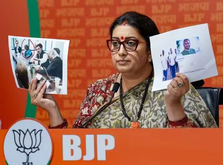 Smriti Irani, during a press conference in Delhi, showing Rahul Gandhi
