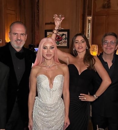 Sofía Vergara posing with a glass of alcohol