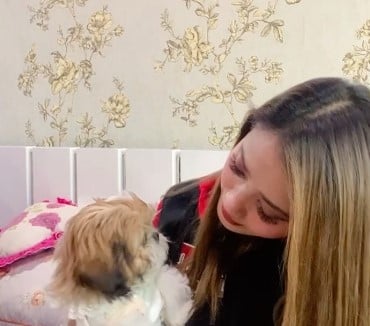 Soma Laishram with her pet dog