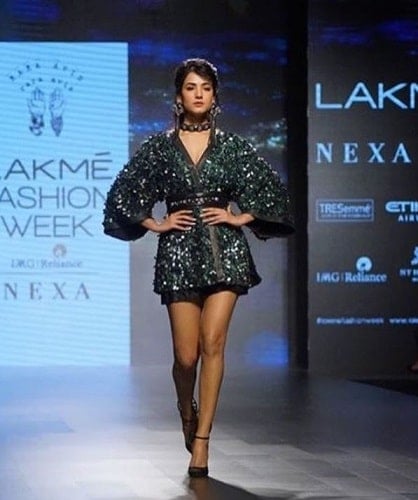 Sonal Chauhan walking the ramp in a fashion show