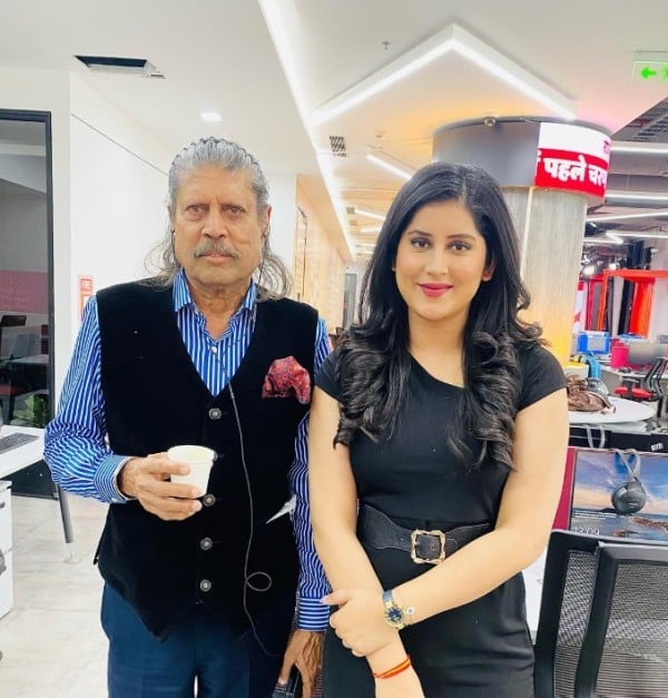 Sonal Mudgal with the Indian cricketer Kapil Dev at the ABP studio