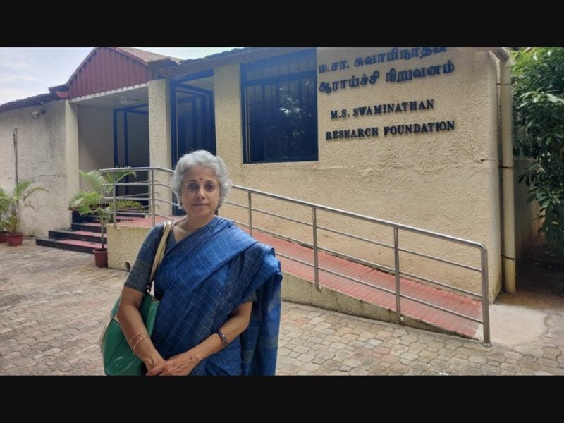 Soumya Swaminathan standing in front of her father