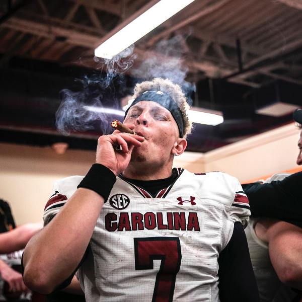 Spencer Rattler smoking a cigar roll