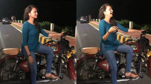 Sri Satya posing with a bike