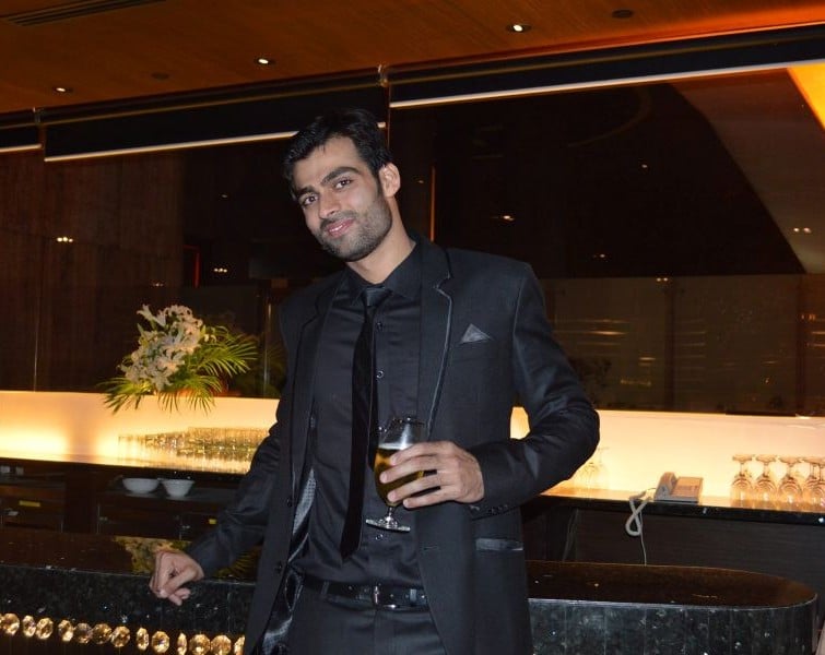 Srikant Dwivedi with a glass of alcohol