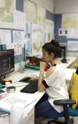 Srishti Sudhera working inside her office