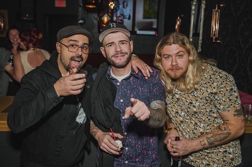 Steve Gonsalves holding a glass of alcohol