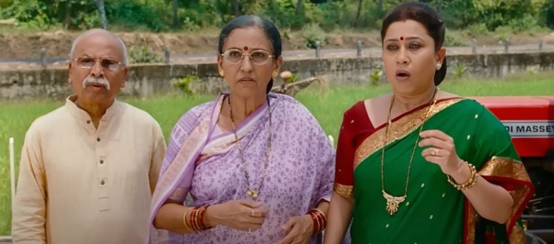 Suchitra Bandekar (wearing green) in a still from the Hindi film titled ‘Singham’ (2011)