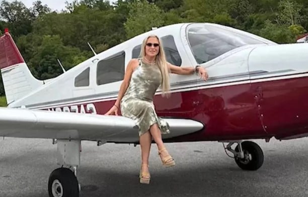 Sue Smey posing at her workplace