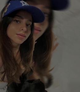 Suhana Khan with a cat in her lap