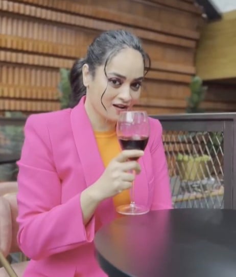 Suja Varunee while enjoying wine