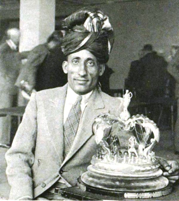Sultan Khan with his trophy after winning the British Chess Championship (1932)