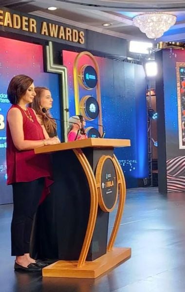 Sumaira Abidi (wearing red) anchoring the CNBC-TV18