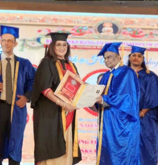 Sumalatha receiving her doctorate at the United Technological Research University of America, Hyderabad