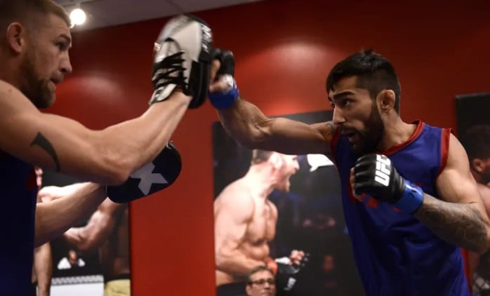 Suman Mokhtarian (R) while warming up backstage during the filming of The Ultimate Fighter Undefeated on 16 February 2017 in Las Vegas, Nevada