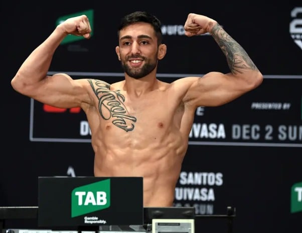 Suman Mokhtarian posing on the scale during the UFC Fight Night weigh-in event at Hilton Adelaide on 30 November 2018 in Adelaide, Australia