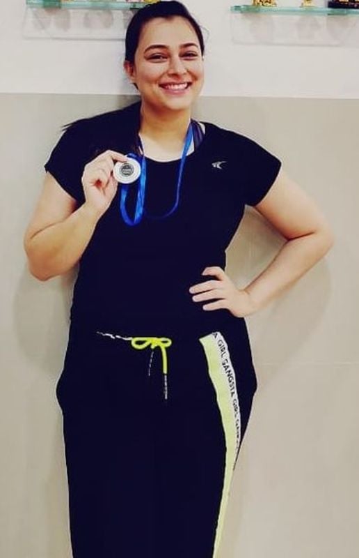 Sumedha Karmahe with her silver medal which she won in her school