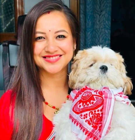 Sumi Borah posing with her pet
