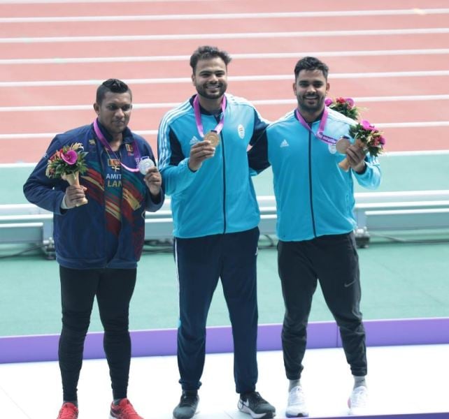 Sumit Antil, along with others at the podium, after winning a gold medal at the 2023 Asian Para Games