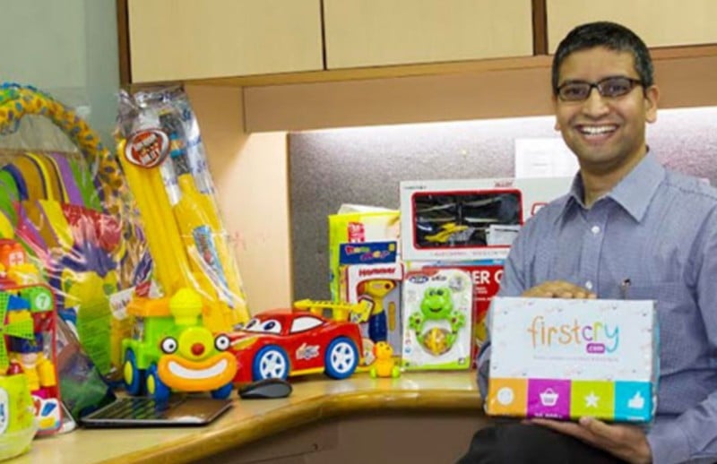 Supam Maheshwari holding a product of FirstCry