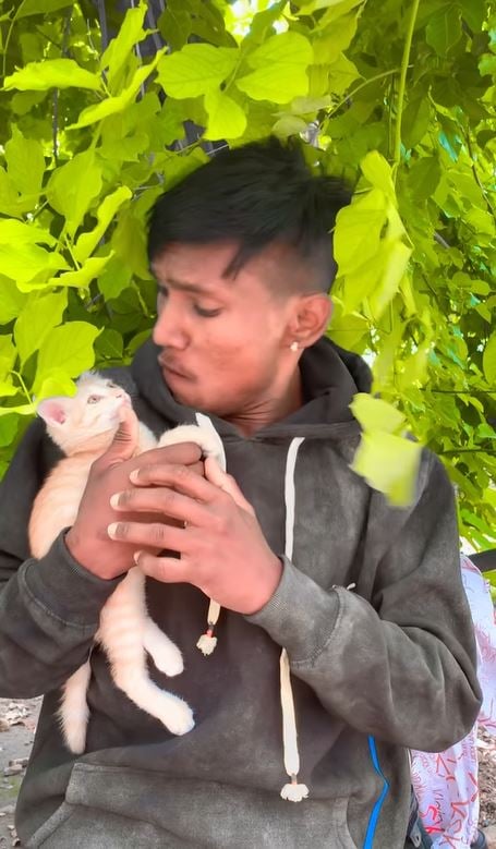 Suraj Chavan with a cat