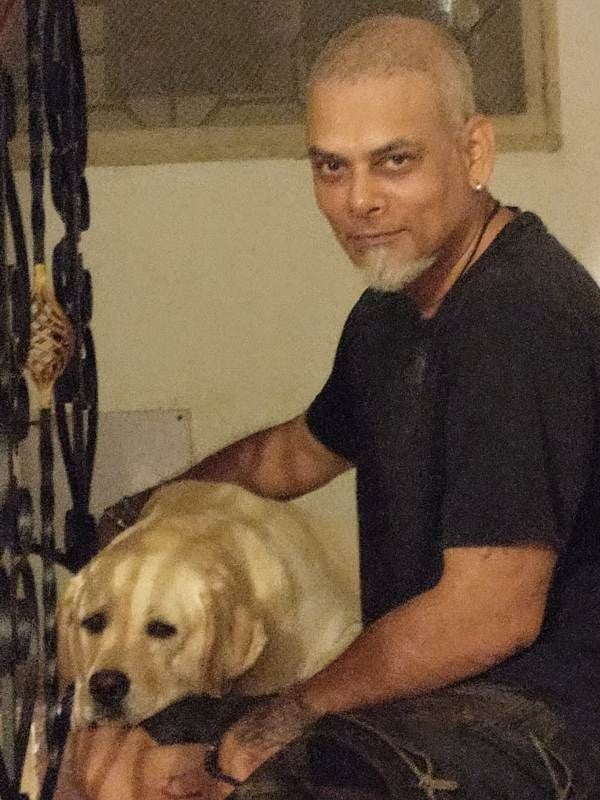 Suraj Jagan with his pet dog