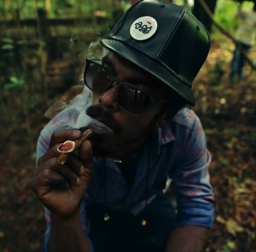 Suraj Pops while smoking an e-cigar